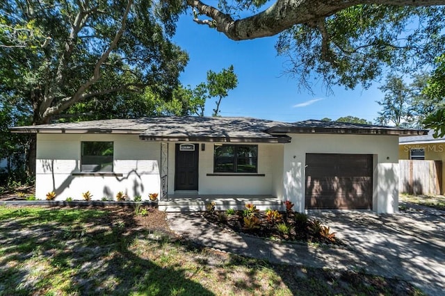 ranch-style home featuring a garage