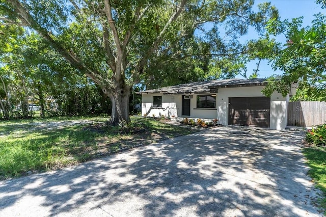 single story home featuring a garage