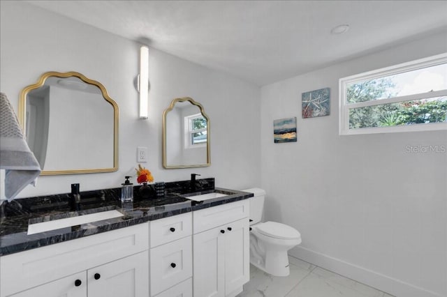 bathroom featuring vanity and toilet