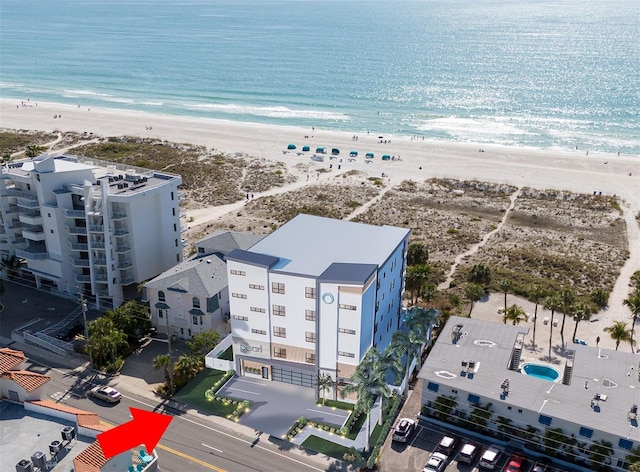 drone / aerial view featuring a view of the beach and a water view