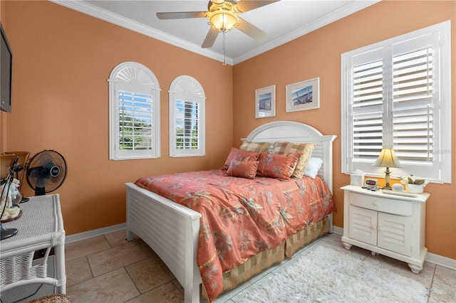 tiled bedroom with ceiling fan and ornamental molding