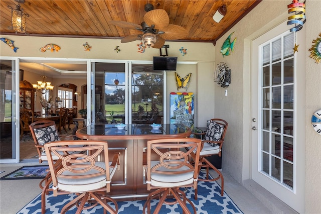 view of patio featuring an outdoor bar and ceiling fan