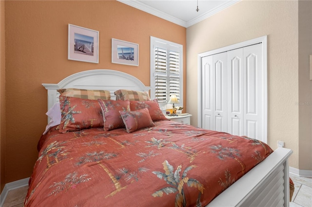 bedroom with light tile patterned floors, a closet, and ornamental molding