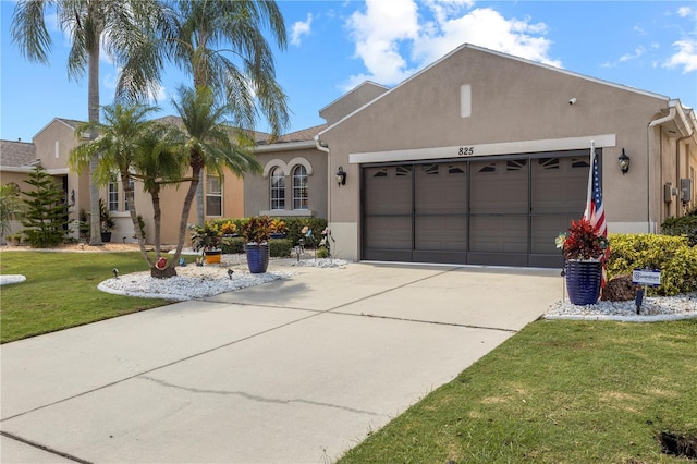 view of front facade with a front yard and a garage