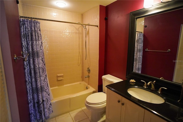 full bathroom featuring vanity, shower / bath combo with shower curtain, toilet, and tile patterned floors