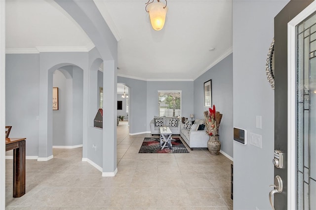 entryway featuring crown molding and light tile patterned floors