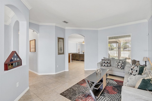 tiled living room featuring ceiling fan and crown molding