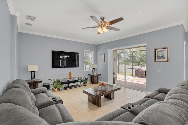 living room featuring crown molding, light tile patterned floors, and ceiling fan