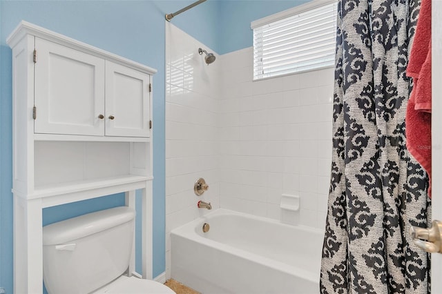 bathroom with shower / tub combo with curtain and toilet