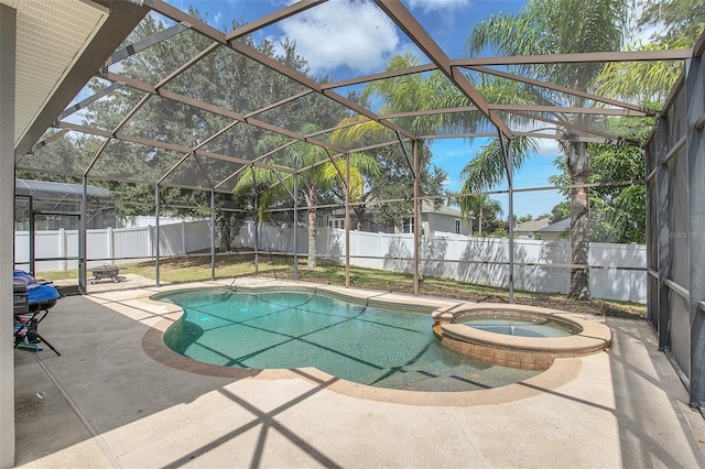 view of pool with a lanai, a patio, and an in ground hot tub