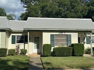 bungalow-style house with a front lawn