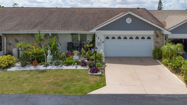 ranch-style home featuring a garage and a front lawn