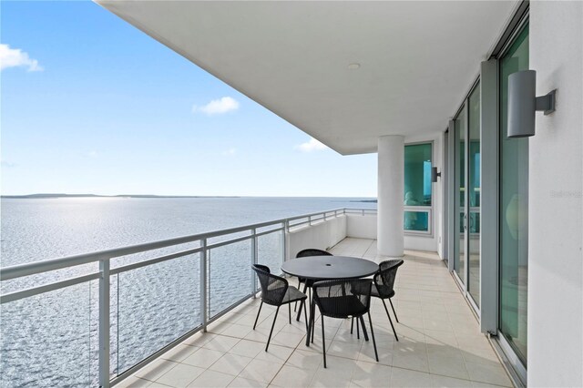 balcony featuring a water view