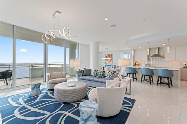 living room featuring plenty of natural light and sink