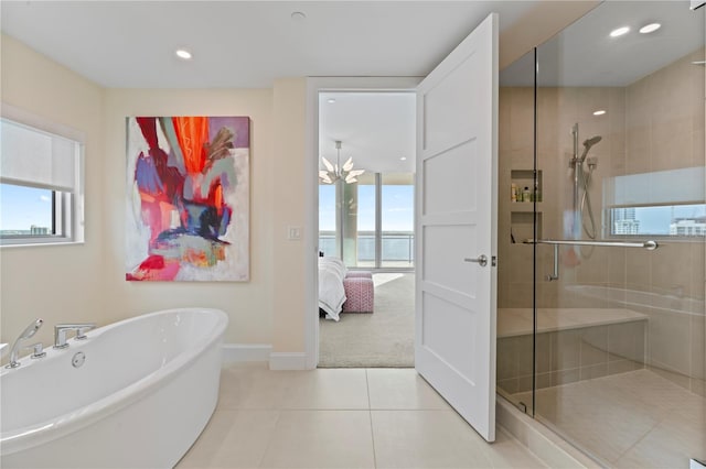 bathroom featuring independent shower and bath and tile patterned floors