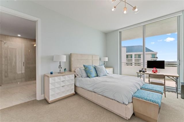 carpeted bedroom featuring a notable chandelier