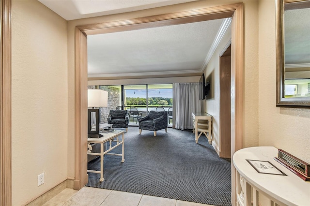 36750 US Highway 19 N Unit 04308, Palm Harbor, FL 34684 - living area featuring a textured wall, crown molding, baseboards, and carpet