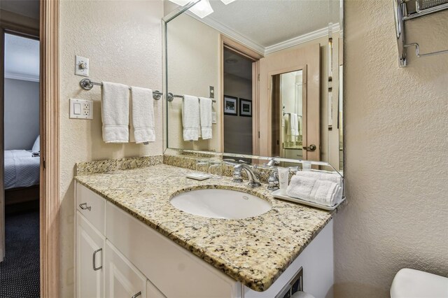 36750 US Highway 19 N Unit 04308, Palm Harbor, FL 34684 - bathroom with a textured wall, crown molding, vanity, and toilet