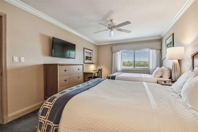 36750 US Highway 19 N Unit 04308, Palm Harbor, FL 34684 - bedroom featuring dark carpet, crown molding, baseboards, a textured ceiling, and ceiling fan
