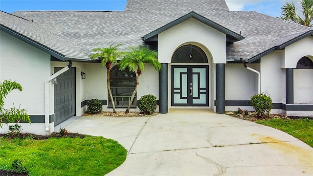 doorway to property with a garage