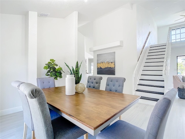 dining area featuring light hardwood / wood-style floors and ceiling fan