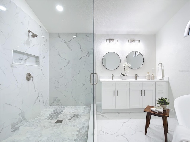 bathroom with vanity and a shower with shower door