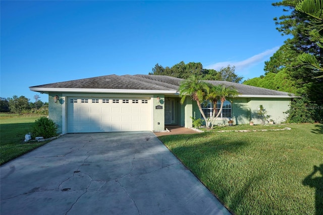 ranch-style house with a garage and a front lawn