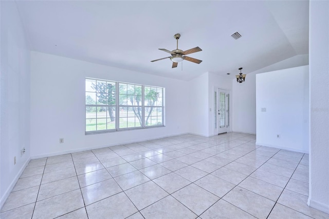 tiled empty room featuring ceiling fan and lofted ceiling