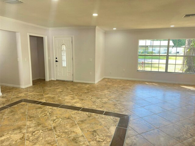 entrance foyer featuring ornamental molding