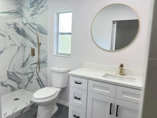 bathroom featuring walk in shower, vanity, and toilet