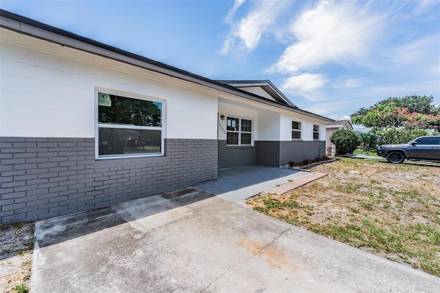 view of side of home featuring a patio