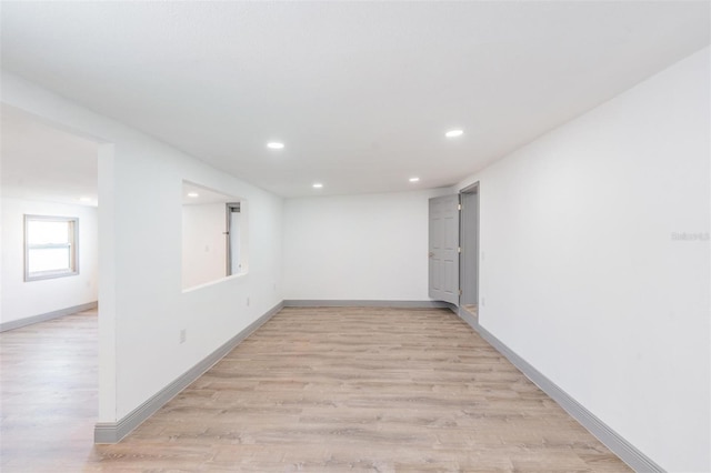 spare room featuring light hardwood / wood-style floors