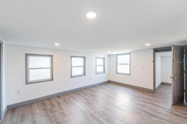 spare room featuring light hardwood / wood-style floors