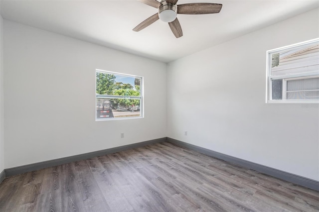 empty room featuring light hardwood / wood-style floors and ceiling fan