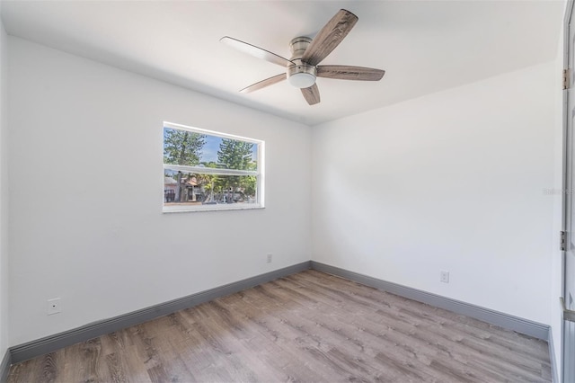 spare room with ceiling fan and light hardwood / wood-style flooring