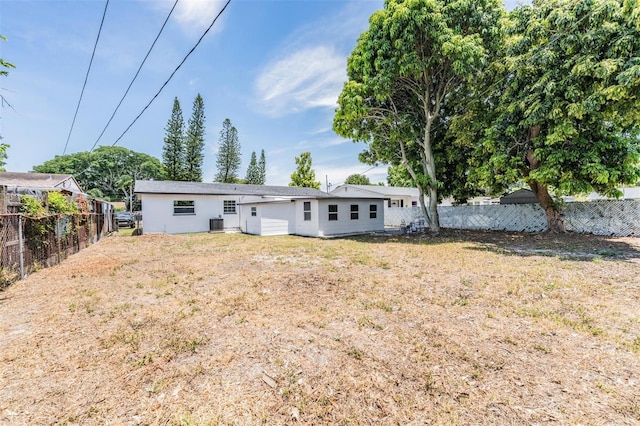 back of house with a yard