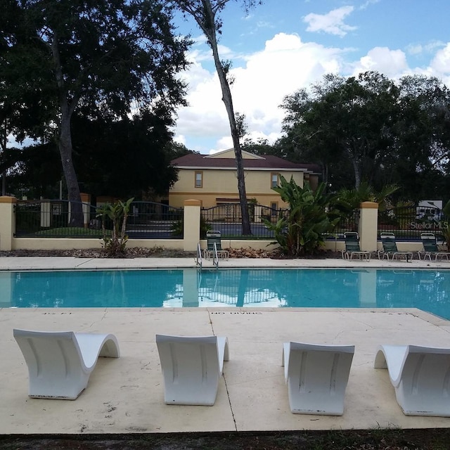 view of swimming pool featuring a patio