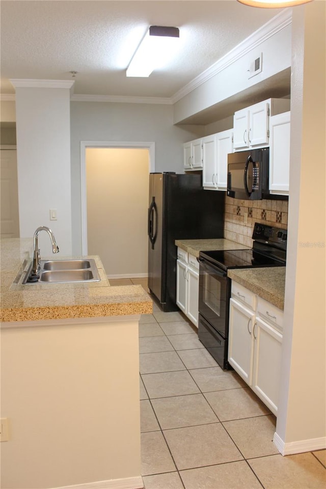 kitchen featuring sink, decorative backsplash, white cabinets, black appliances, and ornamental molding