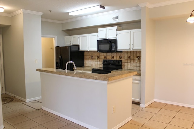 kitchen featuring light tile patterned floors, backsplash, white cabinetry, and black appliances