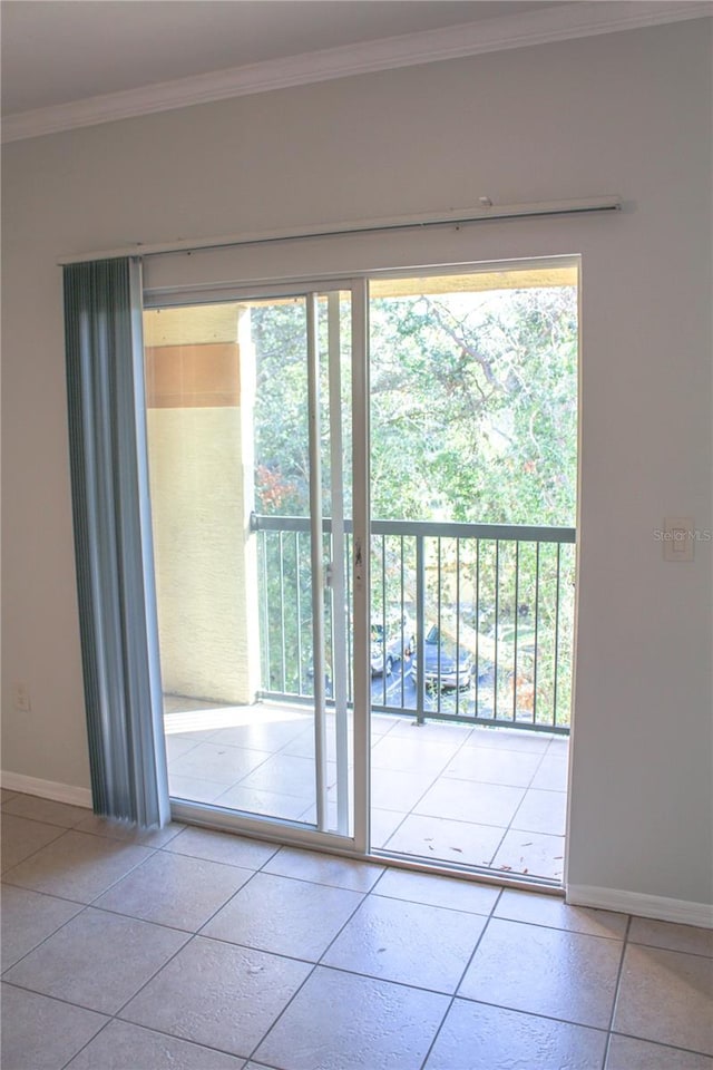 doorway featuring crown molding and tile patterned flooring