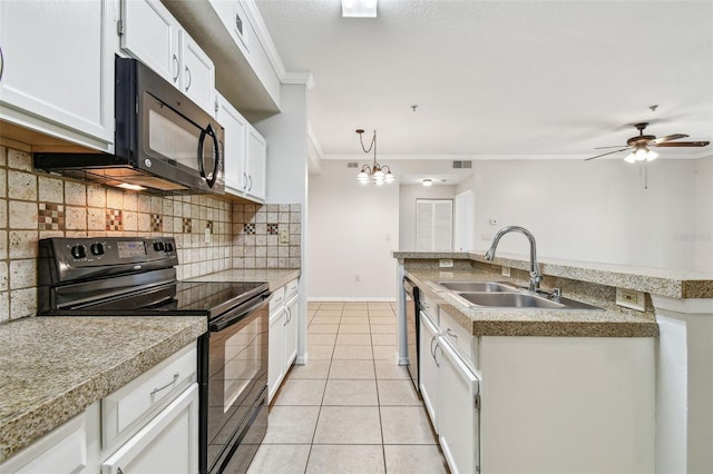 5608 Pinnacle Heights Cir Unit 305, Tampa, FL 33624 - kitchen featuring black appliances, a sink, crown molding, decorative backsplash, and light tile patterned floors