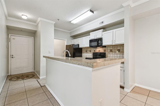 5608 Pinnacle Heights Cir Unit 305, Tampa, FL 33624 - kitchen with black appliances, light tile patterned floors, backsplash, white cabinets, and crown molding