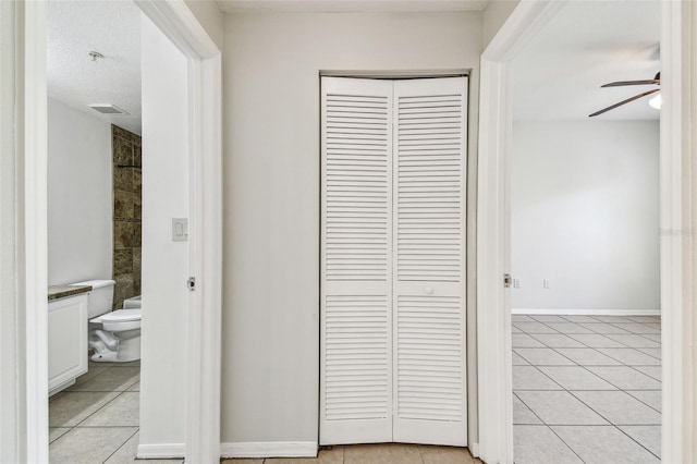 5608 Pinnacle Heights Cir Unit 305, Tampa, FL 33624 - corridor with light tile patterned floors and baseboards