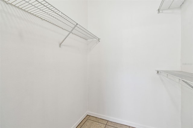 5608 Pinnacle Heights Cir Unit 305, Tampa, FL 33624 - spacious closet featuring light tile patterned floors