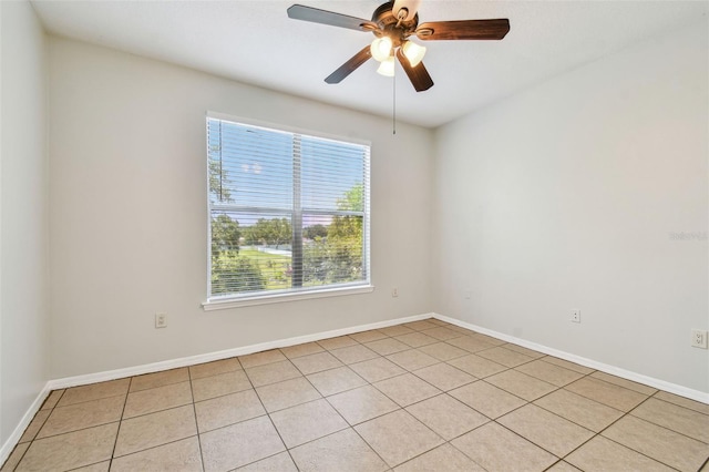 5608 Pinnacle Heights Cir Unit 305, Tampa, FL 33624 - empty room with ceiling fan, baseboards, and light tile patterned flooring