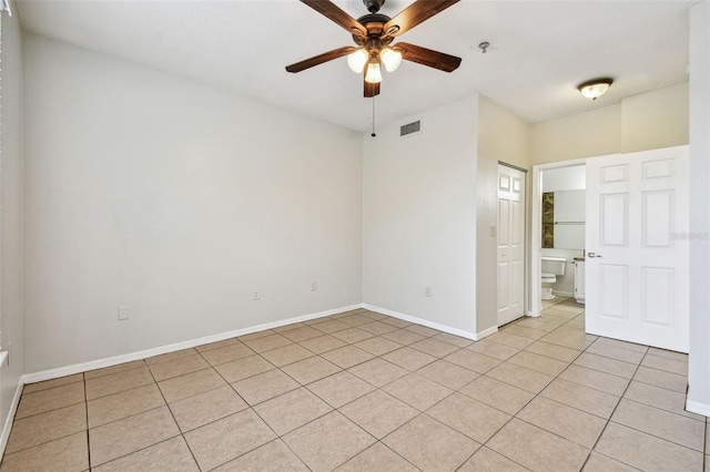 5608 Pinnacle Heights Cir Unit 305, Tampa, FL 33624 - spare room featuring ceiling fan, light tile patterned floors, baseboards, and fire sprinkler in ceiling
