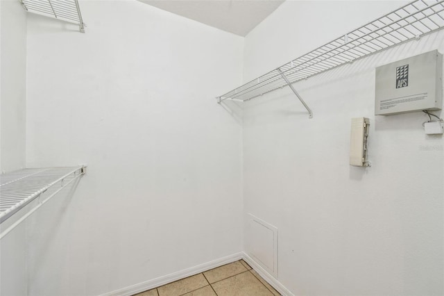 5608 Pinnacle Heights Cir Unit 305, Tampa, FL 33624 - walk in closet featuring light tile patterned floors