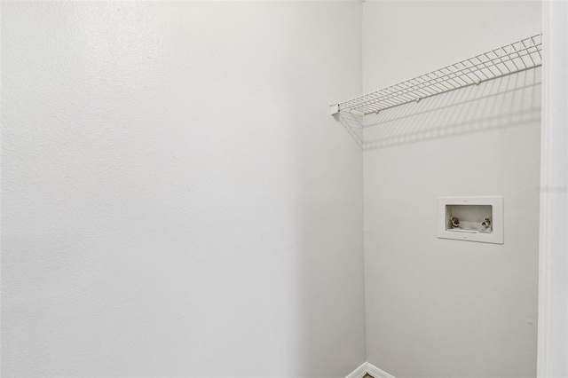 5608 Pinnacle Heights Cir Unit 305, Tampa, FL 33624 - laundry room with hookup for a washing machine and baseboards