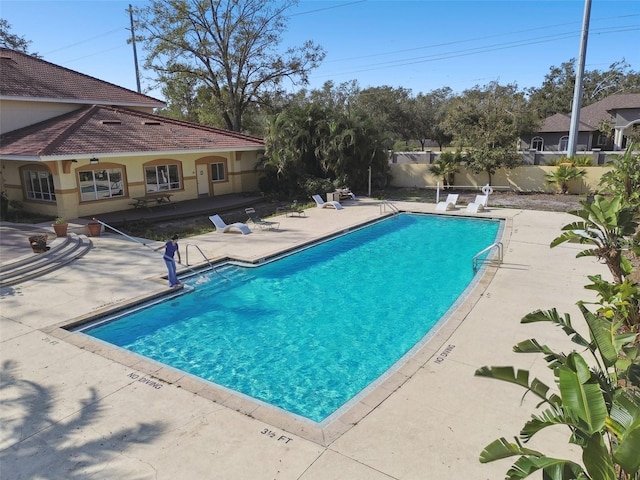 5608 Pinnacle Heights Cir Unit 305, Tampa, FL 33624 - community pool featuring a patio and fence