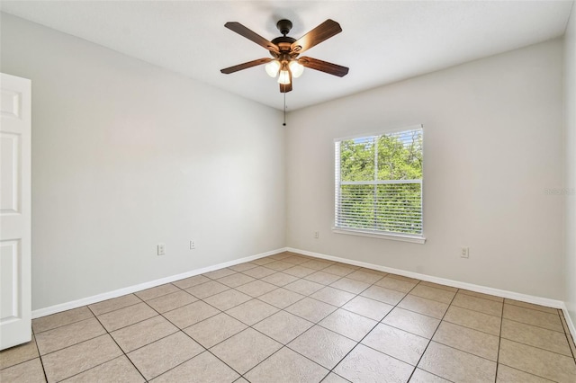 5608 Pinnacle Heights Cir Unit 305, Tampa, FL 33624 - spare room featuring a ceiling fan, light tile patterned flooring, and baseboards